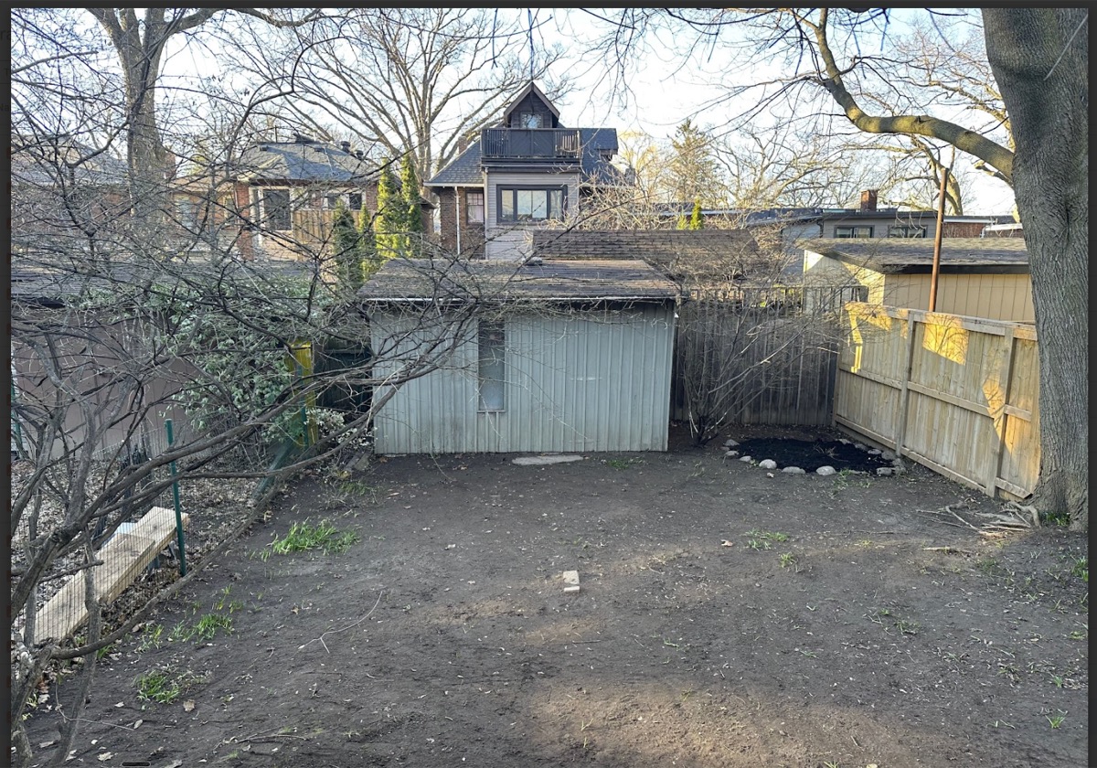 Cleared backyard with clean pavers after cleanup